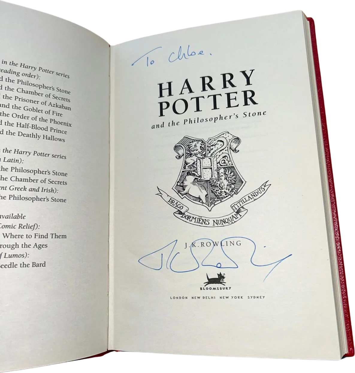 Title page inscribed 'To Chloe' and signed by J.K. Rowling in blue ink